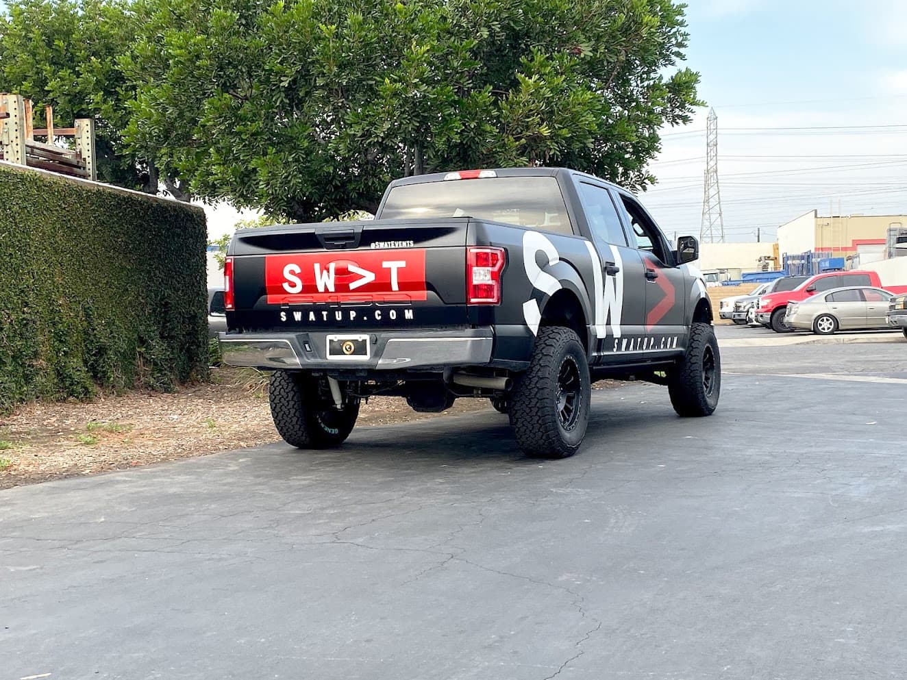 DC Visual - Satin Black Truck Wrap with Spot Graphic Overlays